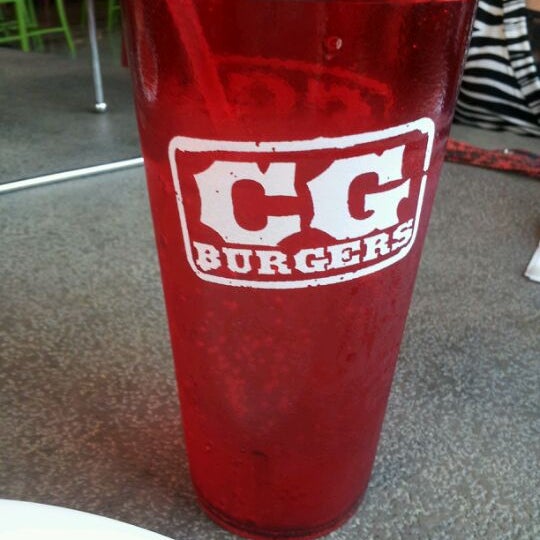 Photo taken at CG Burgers-Merrick by Vanessa F. on 3/28/2012