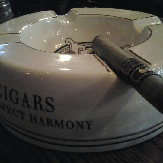 Photo taken at Burns Tobacconist Downtown by L. C. W. on 3/2/2012