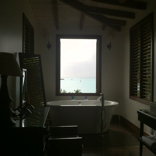 Photo taken at Hermitage Bay - Antigua by Den P. on 3/25/2012