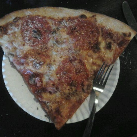 Photo taken at Lucky Slice Pizza by Casey C. on 6/29/2012