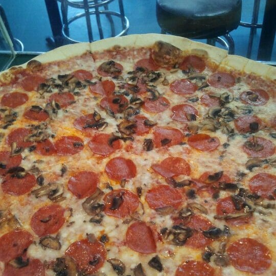 Photo taken at Slices Pizza by Nate C. on 6/6/2012