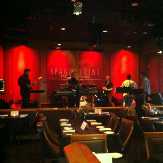 Photo taken at Spaghettini Fine Dining &amp; Entertainment by Hannah V. on 3/26/2012