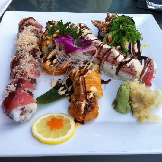 Photo taken at Mura Japanese Restaurant by Jess O. on 8/14/2012