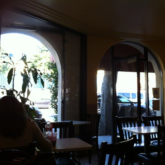 Photo taken at Elysee Café &amp; Bakery by Bin on 4/18/2012