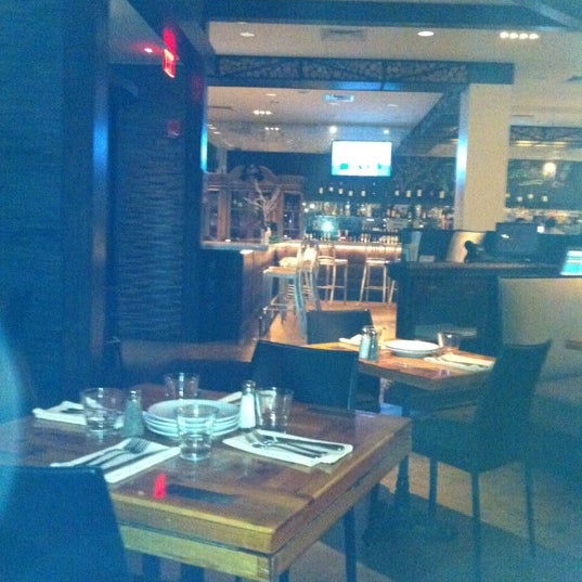 Photo taken at Rizzuto&#39;s Restaurant &amp; Bar by Armando S. on 3/5/2012