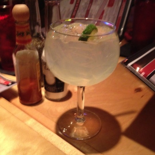 Photo taken at Roja Mexican Grill + Margarita Bar by Elle B. on 3/15/2012