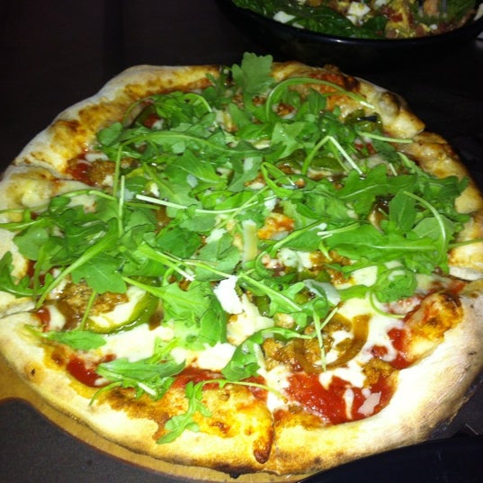 Photo taken at Treza Fine Salad &amp; Wood-Fired Pizza Co by A A. on 3/15/2012