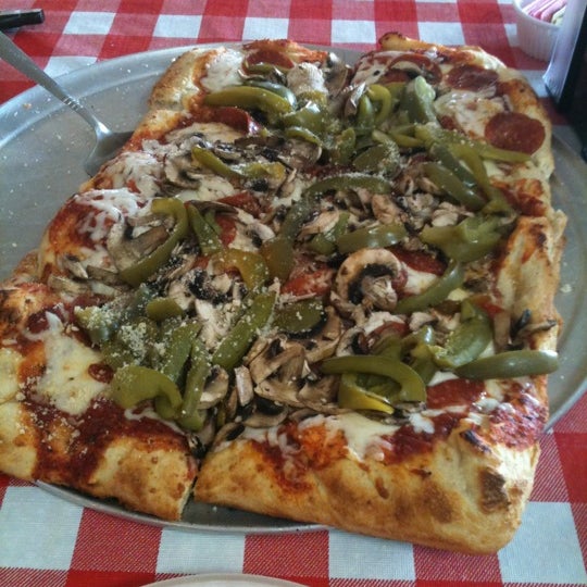 Photo taken at Authentic New York Pizza by Fernando M. on 3/20/2012