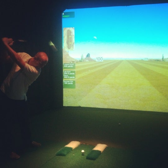 Photo taken at The Range Golf Center &amp; Sports Bar by Betsy S. on 7/21/2012