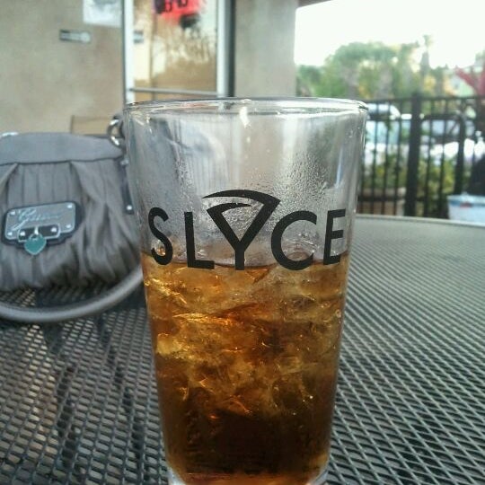 Photo taken at Slyce Pizza Bar by Jay T. on 3/5/2012