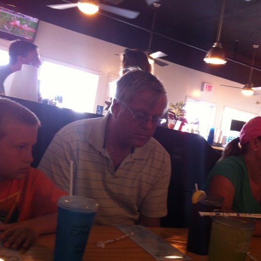 Photo taken at Corolla Cantina Bar and Grill by Eric C. on 7/25/2012