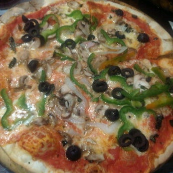 Photo taken at Sette Pizza by Ignacio C. on 2/15/2012