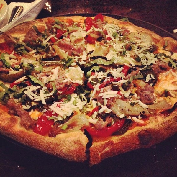 Photo taken at Goodfella&#39;s Woodfired Pizza Pasta Bar by Blake R. on 5/9/2012