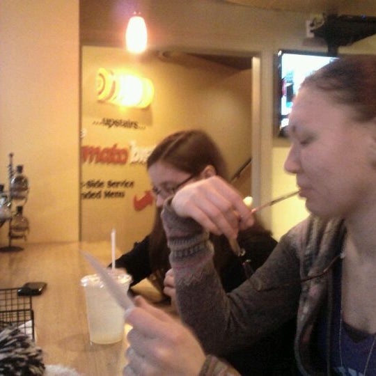 Photo taken at The Couch Tomato Café by Anthony D. on 2/7/2012