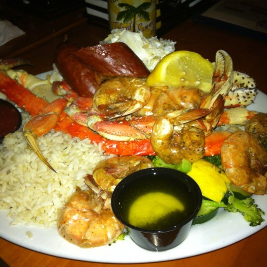 Photo taken at Fish Tails Bar &amp; Grill by Amanda S. on 3/19/2012