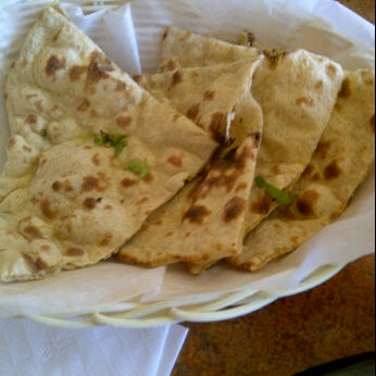 Photo taken at Tarka Indian Kitchen by Sherrl C. on 6/24/2012