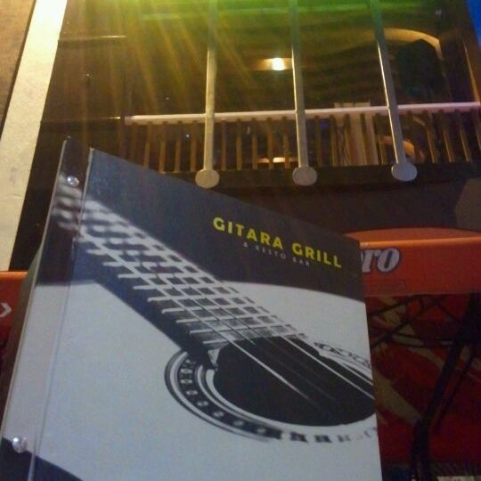 Photo taken at Gitara Grill by Ron O. on 2/26/2012