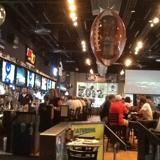 Photo taken at 1st and 10 Sports Bar &amp; Grill by Lorraine S. on 6/20/2012