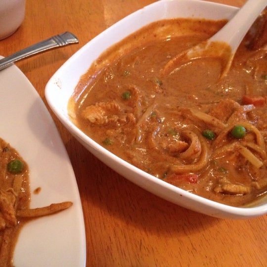 Try the Kang Ped. Its a spicy curry with chicken and its one of my fav dishes I have ever had. I get it like every week.