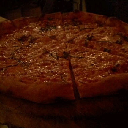 Photo taken at Rocco&#39;s Wood Fired Pizza by Adrian R. on 8/12/2012