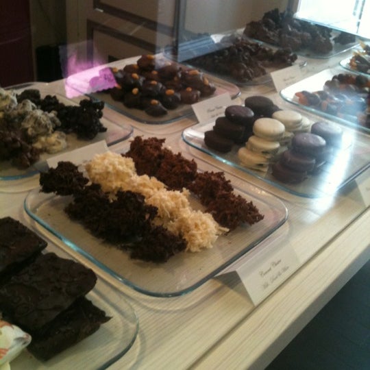 Photo taken at Sinful Sweets Chocolate Company by John M. on 4/17/2012