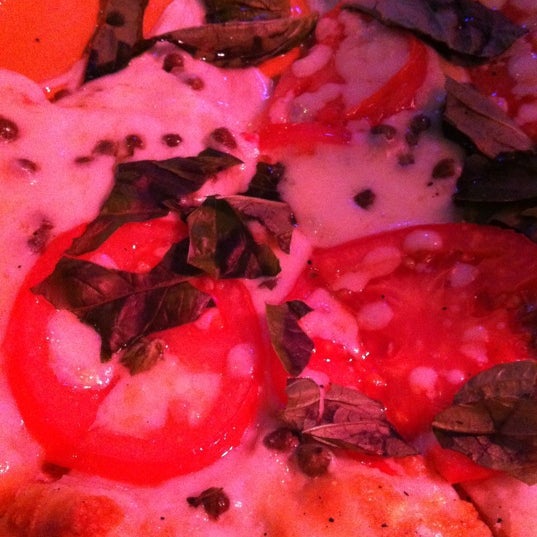 Photo taken at The Rock Wood Fired Pizza by Brenda M. on 5/15/2012