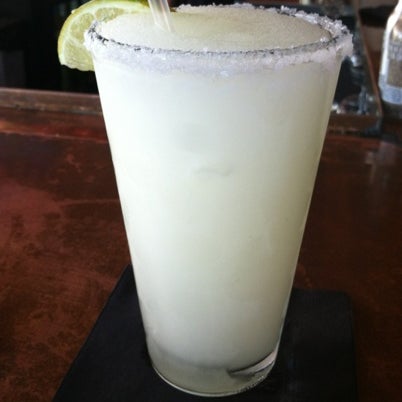 Photo taken at Roja Mexican Grill + Margarita Bar by Joel H. on 8/1/2012