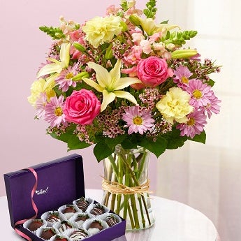 Check Out a new Gift idea for Mom. Flowers + Chocolate covered Strawberries