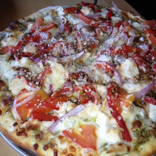 Photo taken at Gusto Pizza Co. by Melissa K. on 6/22/2012