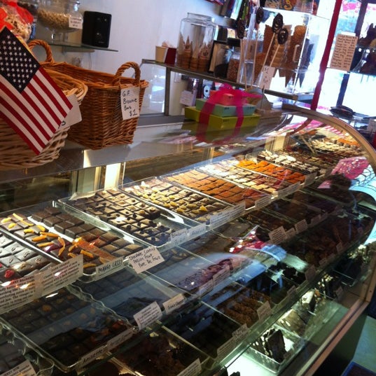 Photo taken at Lucky Chocolates, Artisan Sweets And Espresso by Christie on 7/22/2012