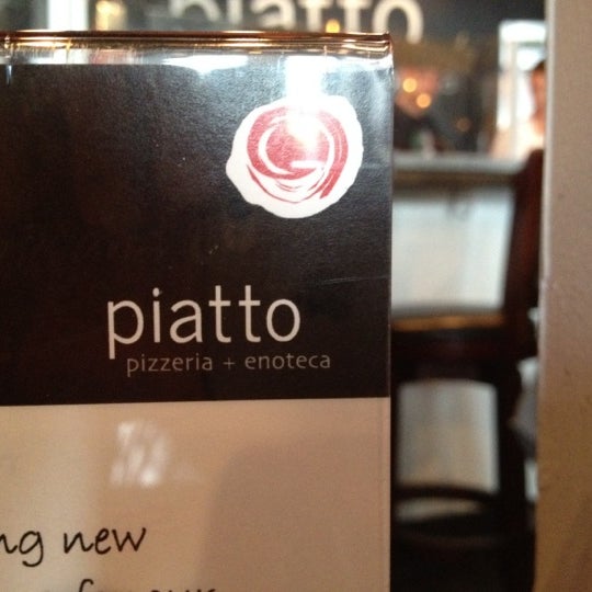 Photo taken at Piatto Pizzeria + Enoteca by Kenny L. on 7/31/2012