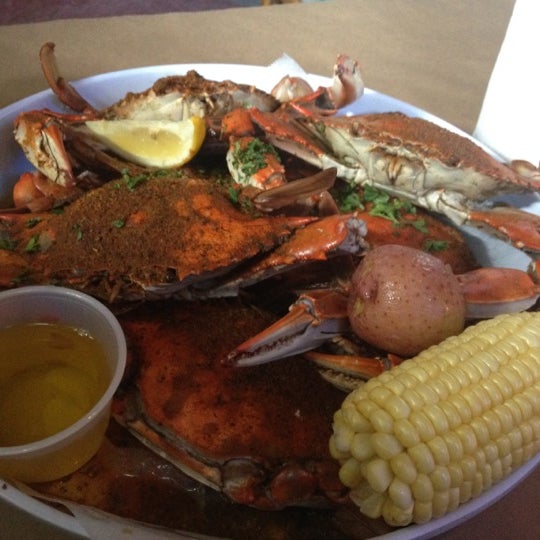 Photo taken at Bum Rogers Crab House &amp; Tavern by Carmen F. on 8/25/2012