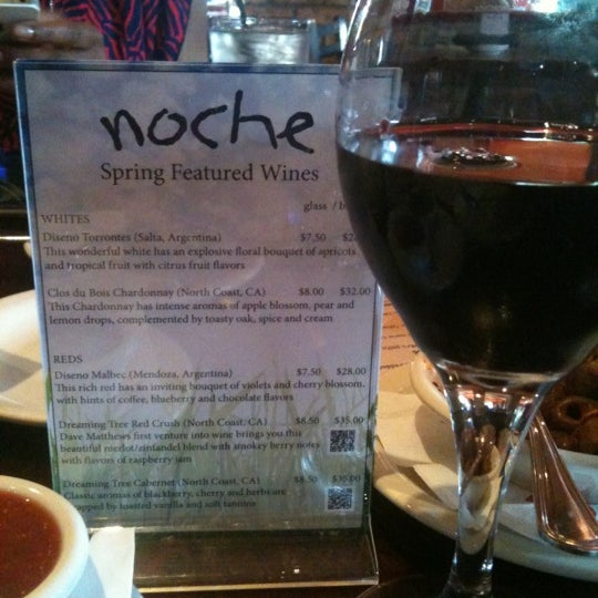 Photo taken at Noche Tequila &amp; Tapas Bar by Lakia C. on 4/7/2012