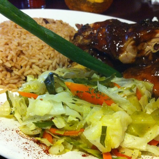 Photo taken at Mangos Caribbean Restaurant by Danielle on 5/9/2012