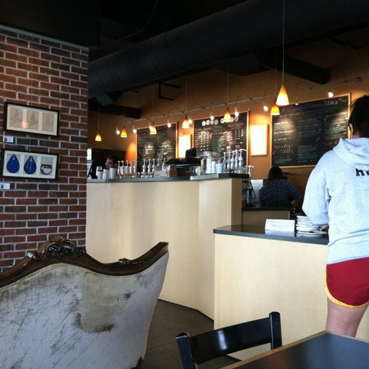 Photo taken at Cafe Milo by Cynthia G. on 5/9/2012