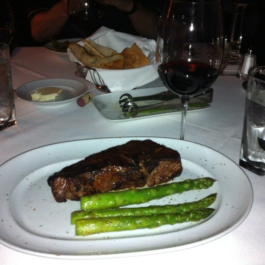 Photo taken at Dominick&#39;s Steakhouse by Chris G. on 4/6/2012