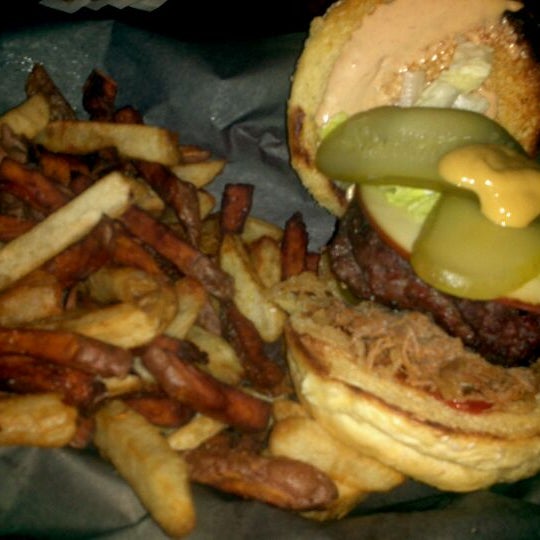 Photo taken at Woody&#39;s Burgers bar and grill by David J. on 2/16/2012