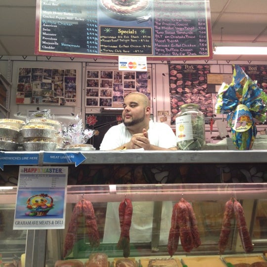 Photo taken at Graham Avenue Meats and Deli by James T. on 4/5/2012