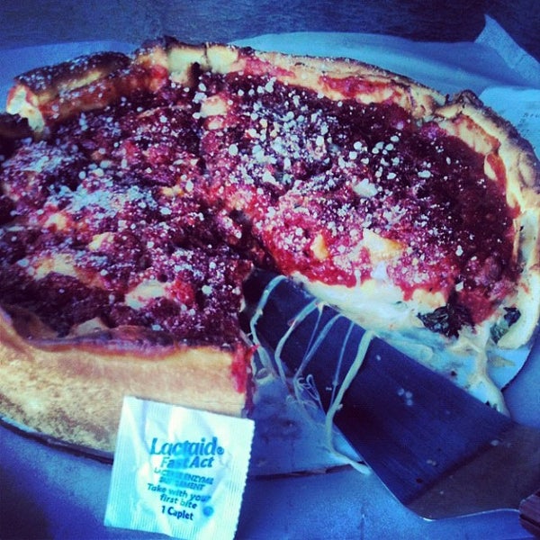 Photo taken at Nancy&#39;s Chicago Pizza by SACHA C. on 9/9/2012