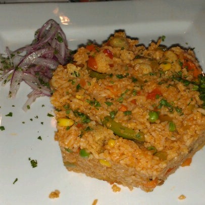 Photo taken at Lola&#39;s Peruvian Restaurant by Kim A. on 6/24/2012