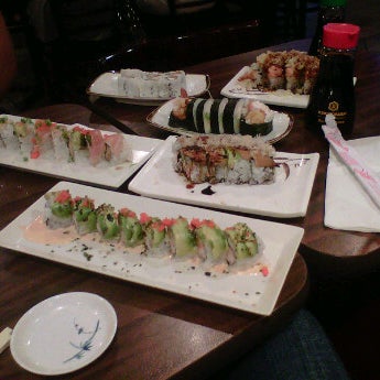 Photo taken at Aisuru Sushi + Sake Bar by Jessica G. on 8/4/2012