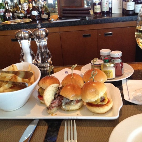 You'll get better service at the bar than at the tables - Kevin is great! Order the truffle fries