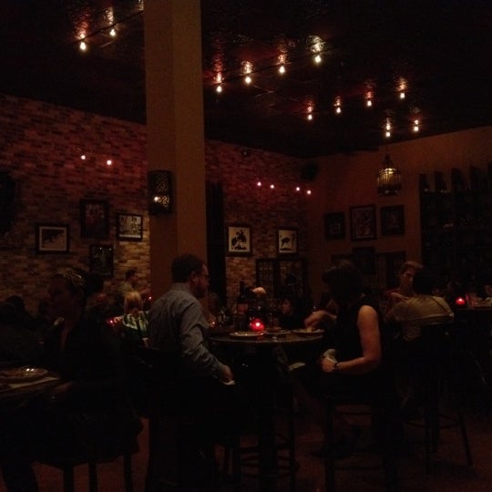 Photo taken at Malaga Tapas &amp; Bar by Colton P. on 3/9/2012