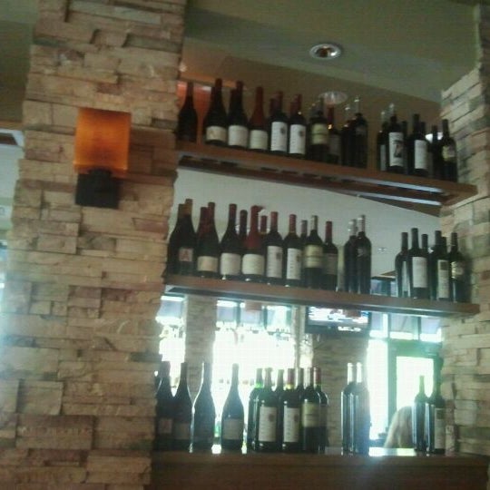 Photo taken at Travinia Italian Kitchen and Wine Bar by Charles N. on 6/5/2012