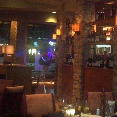 Photo taken at Travinia Italian Kitchen and Wine Bar by Allie M. on 8/26/2012