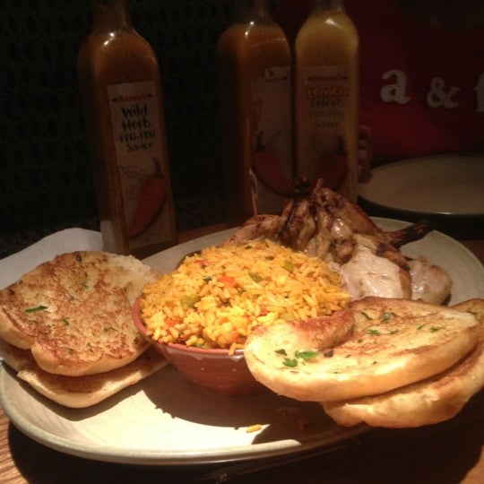 Photo taken at Nando&#39;s by Perlie R. on 8/8/2012