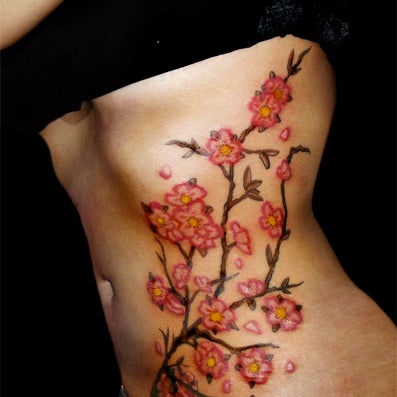 Tattoo by Chris Santos Calavera Tattoo.