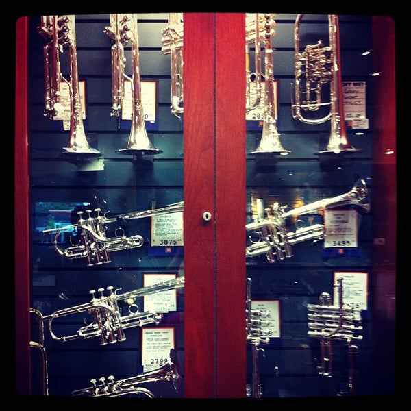 Photo taken at Long &amp; McQuade Musical Instruments by Erin P. on 7/13/2012
