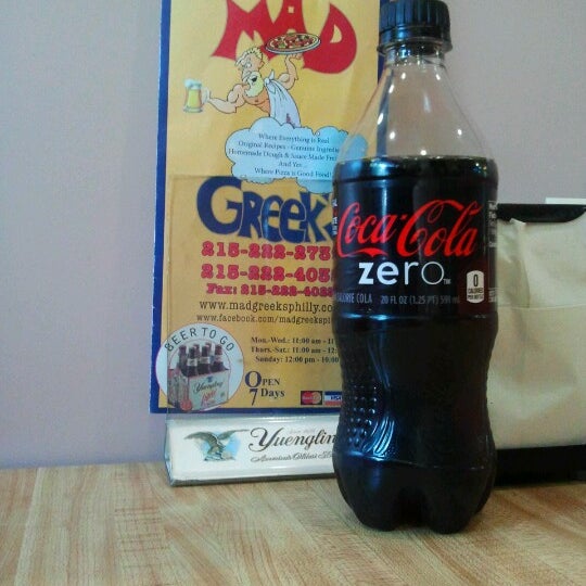 Foto diambil di Mad Greeks Pizza &amp; Take-Out Beer oleh John M. pada 8/18/2012