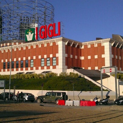 Photo taken at I Gigli Shopping Centre by Marcio I. on 6/16/2012